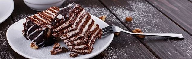 Two slices of layered cake on a plate